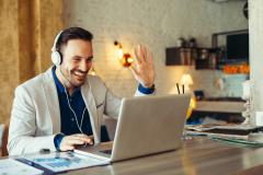 Man have business meeting via video call in a cafe