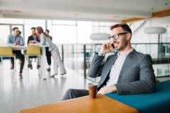 Inspired businesman sitting at coffee-break