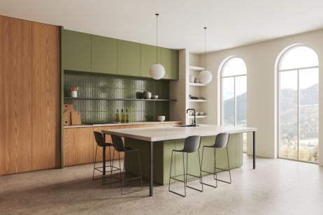Vue sur élégante cuisine en vert sauge et bois 