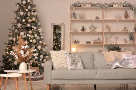 Christmas modern living room with Christmas tree, sofa, shelf with Christmas decorations. Happy new year and merry christmas