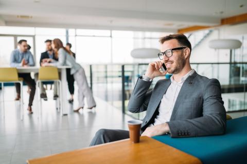 Inspired businesman sitting at coffee-break