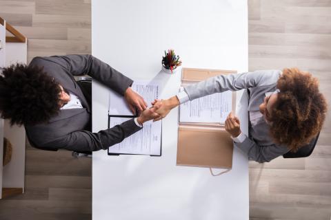 Male Manager Shaking Hands With Female Applicant Male Manager Shaking Hands With Female Applicant